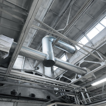 Ductwork installation in a commercial setting, showcasing metal ducts and vents for efficient HVAC airflow in Hidalgo County.