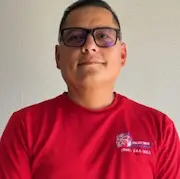 Lalo Enriquez, founder and lead technician of L&S Air LLC, wearing a red shirt, showcasing expertise in HVAC services with over 20 years of experience, emphasizing trust and quality in the Rio Grande Valley community.